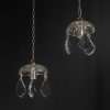 Pareja de difusores de cristal colgantes - Lámparas Escala Pareja de difusores de cristal colgantes vista en perspectiva, con cadena y casquillo E14 listos para instalar